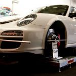 Pro HUBStands brand hub stands and alignment equipment on a Porsche GT 3 Cup